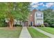 Attractive two-story townhouse with brick accents and lush landscaping, offering curb appeal at 2803 Snapfinger Manor Mnr, Decatur, GA 30035