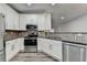 Kitchen featuring stainless steel appliances, stone countertops and mosaic backsplash at 2803 Snapfinger Manor Mnr, Decatur, GA 30035