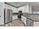 Modern kitchen with stainless steel appliances, granite counters, and white cabinetry at 2803 Snapfinger Manor Mnr, Decatur, GA 30035