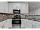 Bright kitchen features granite countertops, stainless steel appliances, and white cabinets at 2803 Snapfinger Manor Mnr, Decatur, GA 30035