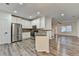 Open kitchen with stainless steel appliances, granite counters, and wood-look floors at 2803 Snapfinger Manor Mnr, Decatur, GA 30035