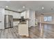 Kitchen features stainless steel appliances, white cabinets, and wood-look floors at 2803 Snapfinger Manor Mnr, Decatur, GA 30035