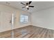 Bright living room featuring wood-look floors, neutral walls, and a ceiling fan at 2803 Snapfinger Manor Mnr, Decatur, GA 30035