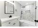 Modern bathroom featuring white vanity and a luxurious marble-tiled shower with black fixtures at 38 Creek Se Dr, Cartersville, GA 30121