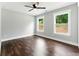 Cozy bedroom with hardwood floors, ceiling fan, and windows with natural light at 38 Creek Se Dr, Cartersville, GA 30121
