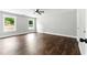 Large bedroom with hardwood floors, ceiling fan, and two large windows at 38 Creek Se Dr, Cartersville, GA 30121