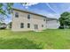 A house with a bright lawn and siding in the background at 7196 Toccoa Circle, Union City, GA 30291