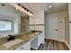 Bathroom featuring double sinks, a large mirror and a walk-in shower at 7196 Toccoa Circle, Union City, GA 30291