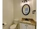 Bathroom featuring granite counters, a toilet and vanity at 7196 Toccoa Circle, Union City, GA 30291