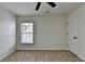 Bedroom featuring neutral carpeting, fresh paint, with bright lighting from the window and a standard doorway at 7196 Toccoa Circle, Union City, GA 30291