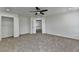 This bedroom features a ceiling fan, neutral carpeting and fresh paint to create a comfortable space at 7196 Toccoa Circle, Union City, GA 30291