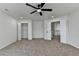 Bedroom featuring neutral carpeting, fresh paint and bright lighting with a closet and doorway entrance at 7196 Toccoa Circle, Union City, GA 30291