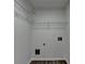 Walk-in closet providing efficient storage with installed shelving and wood-look flooring at 7196 Toccoa Circle, Union City, GA 30291