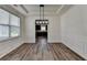 Dining room displaying modern lighting and molding, transitioning into the kitchen at 7196 Toccoa Circle, Union City, GA 30291