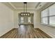 Dining room showing abundant natural light, decorative molding, and modern light fixture at 7196 Toccoa Circle, Union City, GA 30291