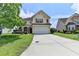 Two-story home with red shutters, manicured lawn, and a long driveway at 7196 Toccoa Circle, Union City, GA 30291