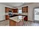 Bright kitchen with granite countertops, stainless steel appliances, wood cabinets and hardwood flooring at 7196 Toccoa Circle, Union City, GA 30291
