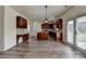 Spacious kitchen with stainless steel appliances, a kitchen island, and hardwood floors at 7196 Toccoa Circle, Union City, GA 30291