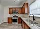 Kitchen boasting stainless steel appliances, granite countertops, tile backsplash, and hardwood floors at 7196 Toccoa Circle, Union City, GA 30291