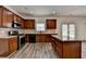 Kitchen featuring wood cabinets, granite countertops, stainless steel appliances, and a center island at 7196 Toccoa Circle, Union City, GA 30291