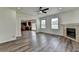 Living room with hardwood floors, a fireplace, and an open floor plan at 7196 Toccoa Circle, Union City, GA 30291
