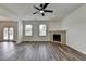 Living room with hardwood floors, a fireplace, and natural light at 7196 Toccoa Circle, Union City, GA 30291