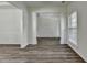 Bright living room showcasing hardwood floors and decorative molding throughout the open-concept space at 7196 Toccoa Circle, Union City, GA 30291