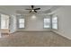 Spacious main bedroom with neutral carpet and ceiling fan at 7196 Toccoa Circle, Union City, GA 30291