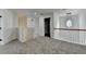 Open carpeted upstairs area with a modern chandelier and views into several rooms at 7196 Toccoa Circle, Union City, GA 30291