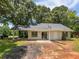 Inviting exterior with covered parking, patio, and lush green space offers outdoor enjoyment at 978 Monopoly Dr, Lawrenceville, GA 30046