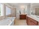 Bright bathroom featuring a soaking tub, separate shower, and double vanities at 2428 Hadlow Ln # 25, Atlanta, GA 30339