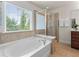Bathroom featuring a soaking tub and separate shower at 2428 Hadlow Ln # 25, Atlanta, GA 30339