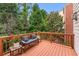 Outdoor deck with wooden bench overlooking a private, wooded backyard at 2428 Hadlow Ln # 25, Atlanta, GA 30339