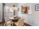 Bright dining room with large window and elegant decor, adjoining open kitchen area at 2428 Hadlow Ln # 25, Atlanta, GA 30339