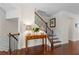 Lovely foyer featuring hardwood floors, a staircase with iron railing and decorative console table at 2428 Hadlow Ln # 25, Atlanta, GA 30339