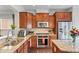 Well-appointed kitchen with granite counters, stainless steel appliances, and hardwood floors at 2428 Hadlow Ln # 25, Atlanta, GA 30339