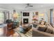 Cozy living room featuring a fireplace, hardwood floors, and neutral decor, great for relaxing at 2428 Hadlow Ln # 25, Atlanta, GA 30339