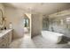 Well-lit bathroom with a free-standing tub and sleek marble shower at 2609 Dogwood Terrace Ne, Atlanta, GA 30319