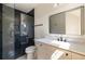 Modern bathroom featuring a glass-enclosed shower with stylish black tile and sleek fixtures at 2609 Dogwood Terrace Ne, Atlanta, GA 30319