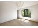 Sun-filled room with hardwood flooring and modern chandelier at 2609 Dogwood Terrace Ne, Atlanta, GA 30319