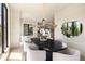 Elegant dining room featuring a modern chandelier, lots of natural light and stylish decor at 2609 Dogwood Terrace Ne, Atlanta, GA 30319