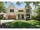 Stunning two-story home featuring a beautiful brick facade, wooden garage doors, and well-maintained landscaping at 2609 Dogwood Terrace Ne, Atlanta, GA 30319