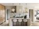 Modern kitchen featuring a large island with seating, marble countertops, and custom cabinetry at 2609 Dogwood Terrace Ne, Atlanta, GA 30319