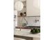 Close-up of the kitchen island with marble countertops, modern faucet, and a view of the custom range hood at 2609 Dogwood Terrace Ne, Atlanta, GA 30319