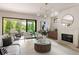 Elegant living room with sliding glass doors leading to an outdoor patio and a contemporary fireplace at 2609 Dogwood Terrace Ne, Atlanta, GA 30319