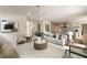 Bright living room featuring modern lighting, comfortable seating, and an open layout to the kitchen area at 2609 Dogwood Terrace Ne, Atlanta, GA 30319