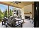 Charming covered patio featuring comfortable seating, an outdoor fireplace, and elegant design elements at 2609 Dogwood Terrace Ne, Atlanta, GA 30319