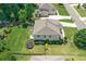 An aerial view shows the home's fenced yard, landscaping, play area, patio, and trampoline at 3420 Pleasant Springs Dr, Cumming, GA 30028