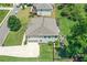 Aerial view showcases the home's spacious backyard with play equipment, trampoline, fire pit and landscaping at 3420 Pleasant Springs Dr, Cumming, GA 30028