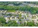 Aerial view of a neighborhood with tree lined streets and well maintained lawns at 3420 Pleasant Springs Dr, Cumming, GA 30028